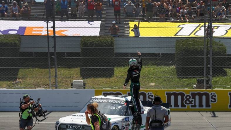 Jul 23, 2022; Long Pond, Pennsylvania, USA; NASCAR Camping World Truck Series driver Chandler Smith celebrates after winning the CRC Brakleen 150 at Pocono Raceway. Mandatory Credit: Matthew OHaren-USA TODAY Sports