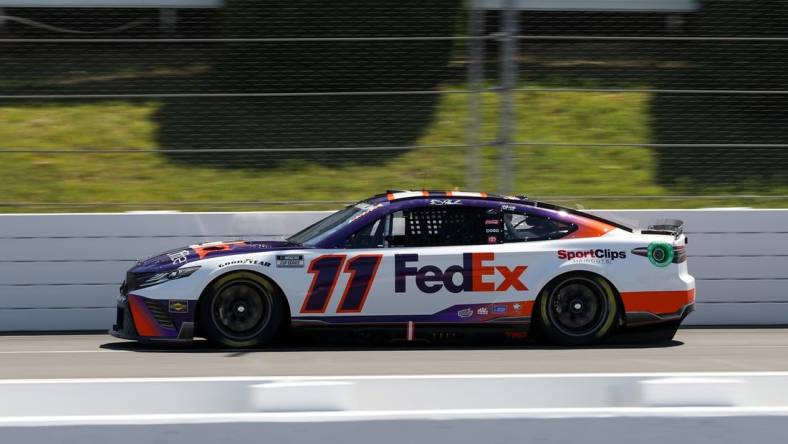 Jul 23, 2022; Long Pond, Pennsylvania, USA; NASCAR Cup Series driver Denny Hamlin (11) during practice and qualifying for the M&Ms Fan Appreciation 400 at Pocono Raceway. Mandatory Credit: Matthew OHaren-USA TODAY Sports