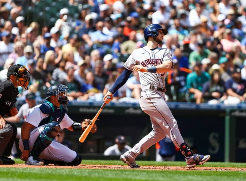 Jul 23, 2022; Seattle, Washington, USA;  Houston Astros right fielder Kyle Tucker (30) follows through on an RBI double against the Seattle Mariners during the fourth inning at T-Mobile Park. Mandatory Credit: Lindsey Wasson-USA TODAY Sports