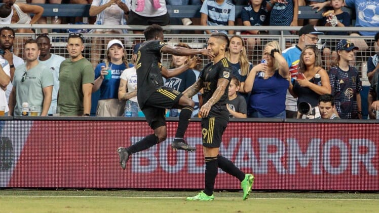 Jul 23, 2022; Kansas City, Kansas, USA; Los Angeles FC forward Cristian Arango (9) celebrates with defender Franco Escobar (2) after a goal against the Sporting Kansas City during the second half at Children's Mercy Park. Mandatory Credit: William Purnell-USA TODAY Sports