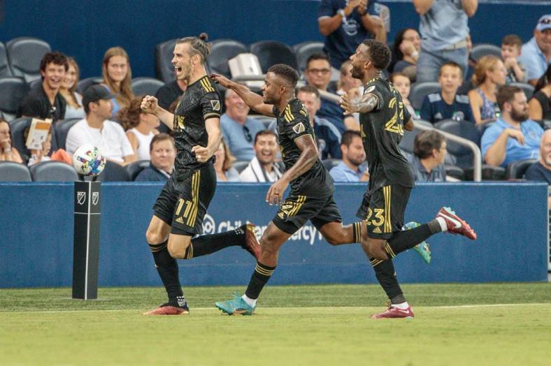 Jul 23, 2022; Kansas City, Kansas, USA; Los Angeles FC midfielder Jose Cifuentes (11) celebrates after scoring a goal against Sporting Kansas City during the second half at Children's Mercy Park. Mandatory Credit: William Purnell-USA TODAY Sports