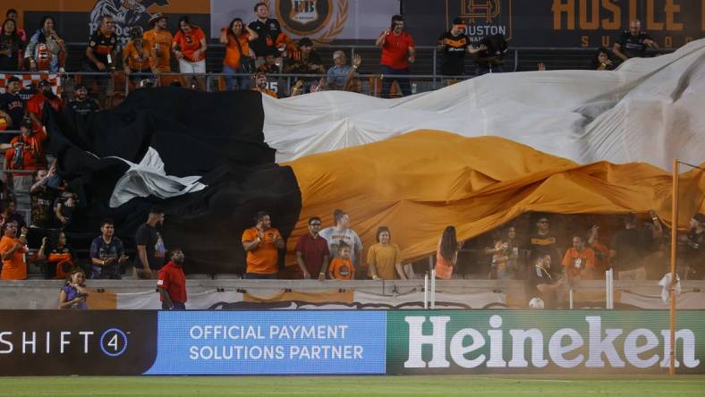 Jul 23, 2022; Houston, Texas, USA; Fans display a tifo after a Houston Dynamo FC goal during the second half against the Minnesota United FC at PNC Stadium. Mandatory Credit: Troy Taormina-USA TODAY Sports