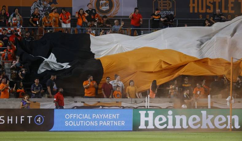 Jul 23, 2022; Houston, Texas, USA; Fans display a tifo after a Houston Dynamo FC goal during the second half against the Minnesota United FC at PNC Stadium. Mandatory Credit: Troy Taormina-USA TODAY Sports