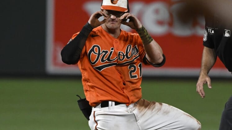 Jul 23, 2022; Baltimore, Maryland, USA;  Baltimore Orioles left fielder Austin Hays (21) reacts after hitting a double against the New York Yankees during the sixth inning at Oriole Park at Camden Yards. Mandatory Credit: James A. Pittman-USA TODAY Sports