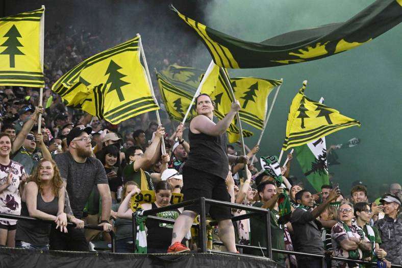 Jul 23, 2022; Portland, Oregon, USA; Portland Timbers fans celebrate the scoring of a goal during the second half against the San Jose Earthquakes at Providence Park. The Timbers won the game 2-1. Mandatory Credit: Troy Wayrynen-USA TODAY Sports