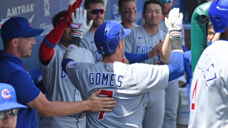 Jul 24, 2022; Philadelphia, Pennsylvania, USA; Chicago Cubs catcher Yan Gomes (7) celebrates his home run in the dugout against the Philadelphia Phillies during the fourth inning at Citizens Bank Park. Mandatory Credit: Eric Hartline-USA TODAY Sports