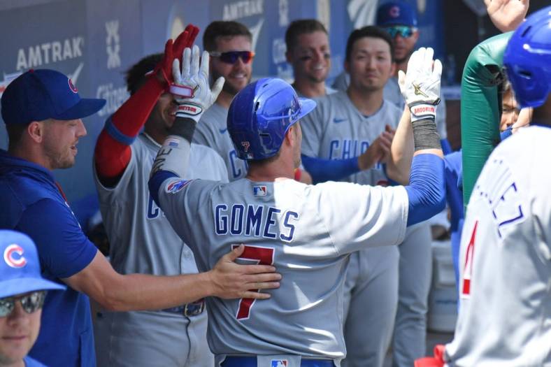 Jul 24, 2022; Philadelphia, Pennsylvania, USA; Chicago Cubs catcher Yan Gomes (7) celebrates his home run in the dugout against the Philadelphia Phillies during the fourth inning at Citizens Bank Park. Mandatory Credit: Eric Hartline-USA TODAY Sports