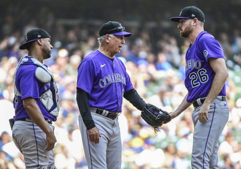 Jul 24, 2022; Milwaukee, Wisconsin, USA; Colorado Rockies manager Bud Black talks to pitcher Austin Gomber (26) during a pitching change in the third inning against the Milwaukee Brewers at American Family Field. Mandatory Credit: Benny Sieu-USA TODAY Sports