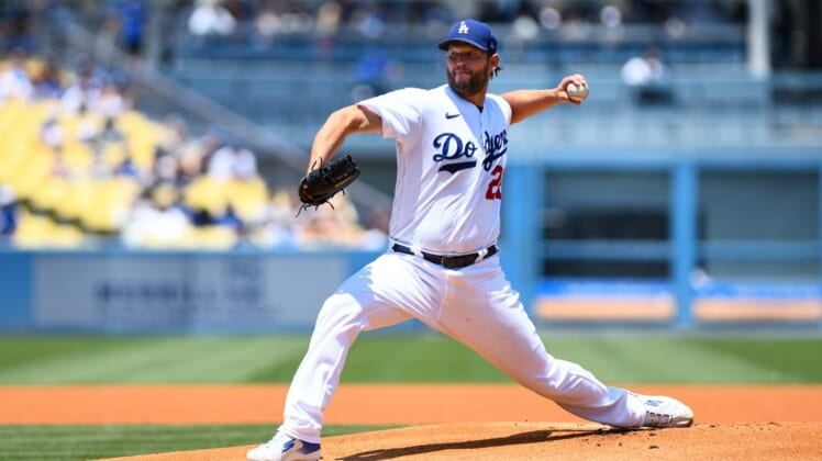 Jul 24, 2022; Los Angeles, California, USA; Los Angeles Dodgers starting pitcher Clayton Kershaw (22) throws a pitch against the San Francisco Giants during the first inning at Dodger Stadium. Mandatory Credit: Jonathan Hui-USA TODAY Sports