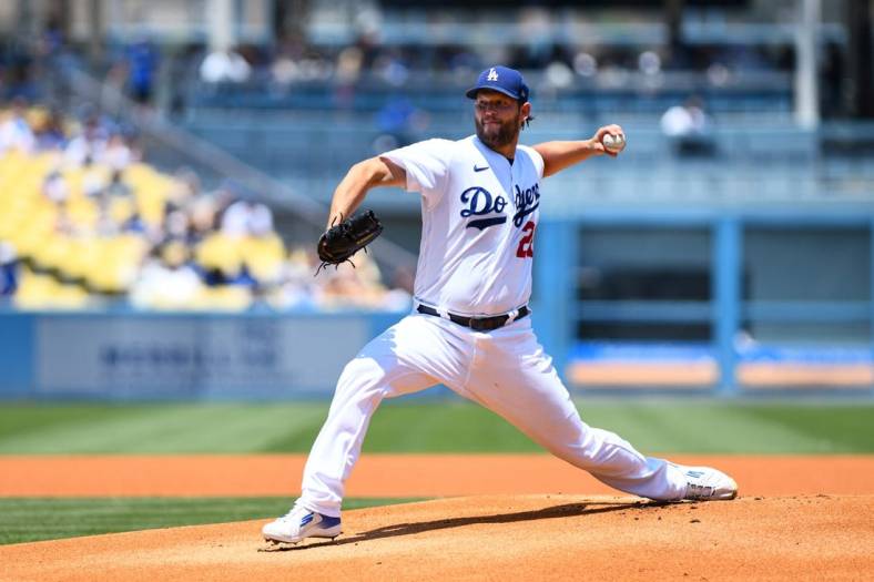 Jul 24, 2022; Los Angeles, California, USA; Los Angeles Dodgers starting pitcher Clayton Kershaw (22) throws a pitch against the San Francisco Giants during the first inning at Dodger Stadium. Mandatory Credit: Jonathan Hui-USA TODAY Sports