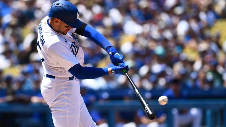 Jul 24, 2022; Los Angeles, California, USA; Los Angeles Dodgers right fielder Trayce Thompson (25) hits a single and earns a RBI against the San Francisco Giants during the third inning at Dodger Stadium. Mandatory Credit: Jonathan Hui-USA TODAY Sports