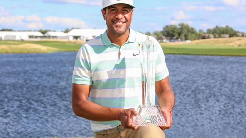 Jul 24, 2022; Blaine, Minnesota, USA; Tony Finau poses with the trophy after winning the 3M Open golf tournament. Mandatory Credit: Matt Krohn-USA TODAY Sports