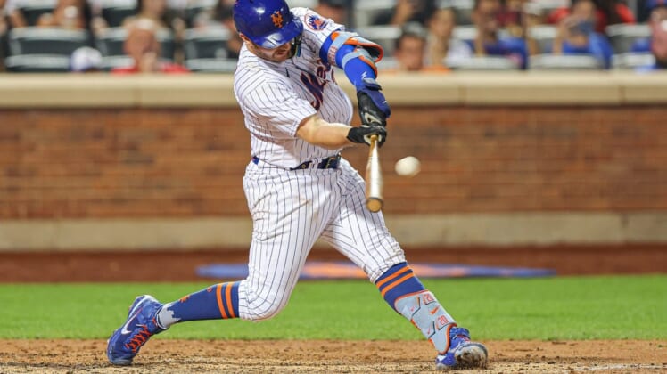 Jul 24, 2022; New York City, New York, USA; New York Mets first baseman Pete Alonso (20) hits a three run home run during the sixth inning against the San Diego Padres at Citi Field. Mandatory Credit: Vincent Carchietta-USA TODAY Sports