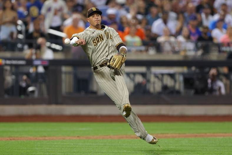 Jul 24, 2022; New York City, New York, USA; San Diego Padres third baseman Manny Machado (13) commits a throwing error during the seventh inning against the New York Mets at Citi Field. Mandatory Credit: Vincent Carchietta-USA TODAY Sports