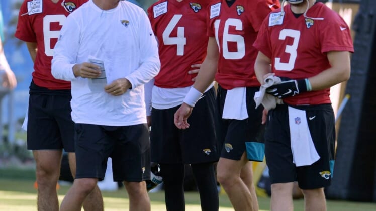 Quarterbacks coach Mike McCoy talks with Jacksonville Jaguars quarterbacks Jake Luton (6), Kyle Sloter (4) , Trevor Lawrence (16) and  C.J. Beathard (3) during drills at Monday morning's training camp session. The Jacksonville Jaguars held their first day of training camp Monday, July 25, 2022 at the Episcopal High School Knight Campus practice fields on Atlantic Blvd.Jki 072522 Jaguarsmondaytrainingcamp 04