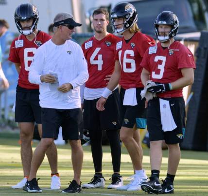 Quarterbacks coach Mike McCoy talks with Jacksonville Jaguars quarterbacks Jake Luton (6), Kyle Sloter (4) , Trevor Lawrence (16) and  C.J. Beathard (3) during drills at Monday morning's training camp session. The Jacksonville Jaguars held their first day of training camp Monday, July 25, 2022 at the Episcopal High School Knight Campus practice fields on Atlantic Blvd.

Jki 072522 Jaguarsmondaytrainingcamp 04