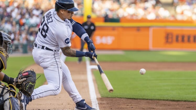 Jul 25, 2022; Detroit, Michigan, USA; Detroit Tigers shortstop Javier Baez (28) hits a sacrifice fly during the third inning against the San Diego Padres at Comerica Park. Mandatory Credit: Raj Mehta-USA TODAY Sports