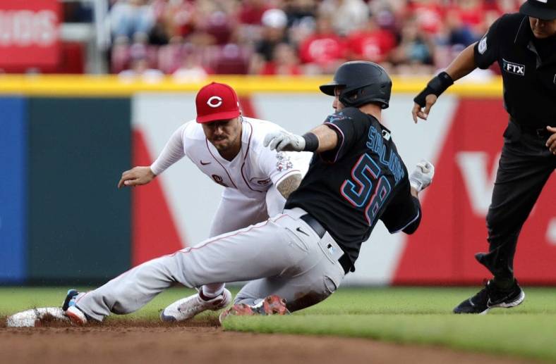 Jul 26, 2022; Cincinnati, Ohio, USA; Miami Marlins catcher Jacob Stallings (58) is tagged out at second against Cincinnati Reds second baseman Jonathan India (6) during the third inning at Great American Ball Park. Mandatory Credit: David Kohl-USA TODAY Sports