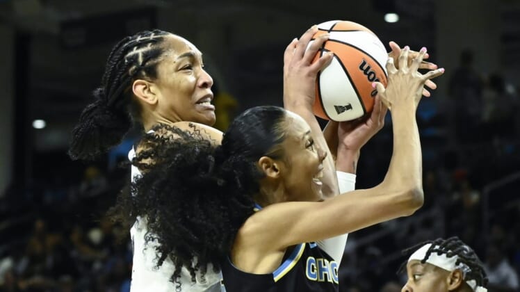 Jul 26, 2022; Chicago, IL, USA;  Las Vegas Aces forward A'ja Wilson (22), left, fights for the ball against Chicago Sky guard Rebekah Gardner (35) during the first half of the Commissioners Cup-Championships at Wintrust Arena. Mandatory Credit: Matt Marton-USA TODAY Sports