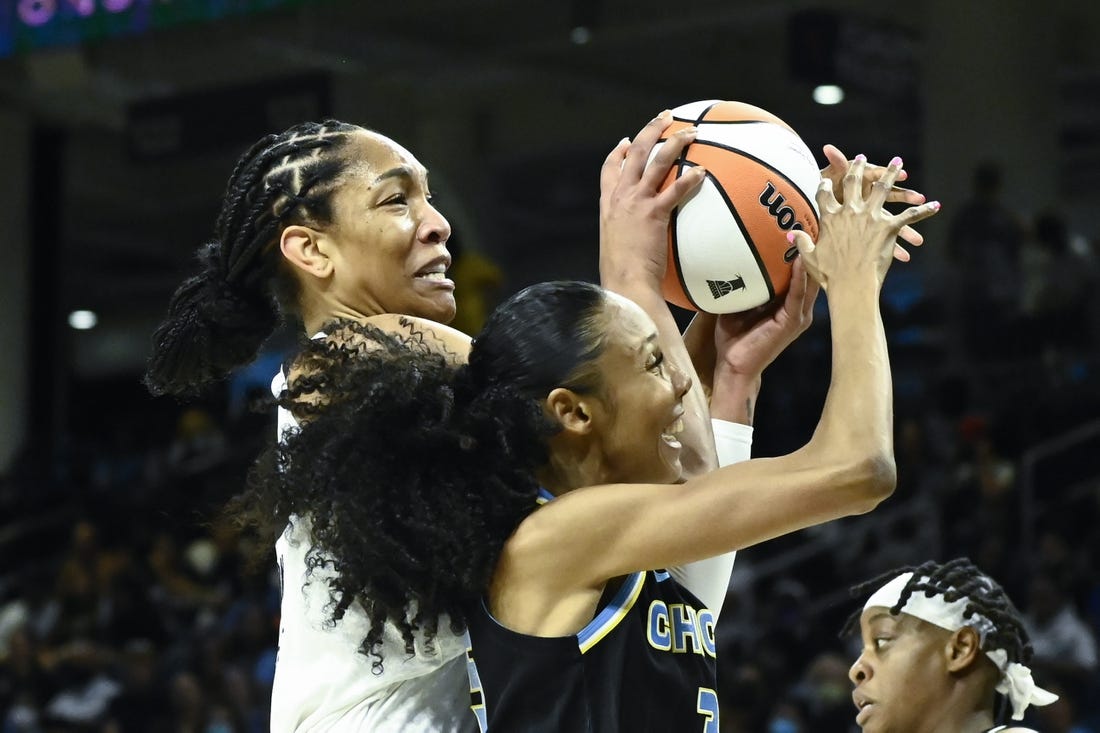 Jul 26, 2022; Chicago, IL, USA;  Las Vegas Aces forward A'ja Wilson (22), left, fights for the ball against Chicago Sky guard Rebekah Gardner (35) during the first half of the Commissioners Cup-Championships at Wintrust Arena. Mandatory Credit: Matt Marton-USA TODAY Sports