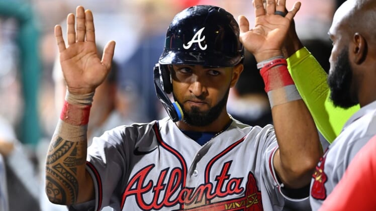 Jul 26, 2022; Philadelphia, Pennsylvania, USA; Atlanta Braves outfielder Eddie Rosario (8) celebrates with teammates after scoring against the Philadelphia Phillies in the ninth inning at Citizens Bank Park. Mandatory Credit: Kyle Ross-USA TODAY Sports