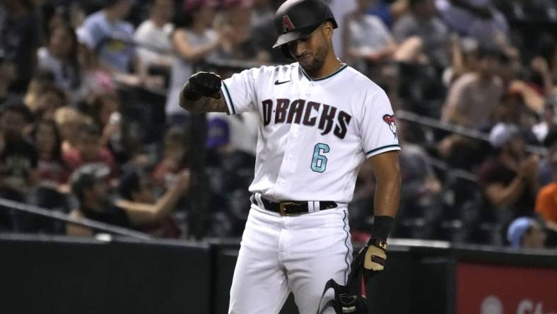 Jul 26, 2022; Phoenix, Arizona, USA; Arizona Diamondbacks left fielder David Peralta (6) reacts after hitting an RBI triple against the San Francisco Giants in the eighth inning at Chase Field. Mandatory Credit: Rick Scuteri-USA TODAY Sports