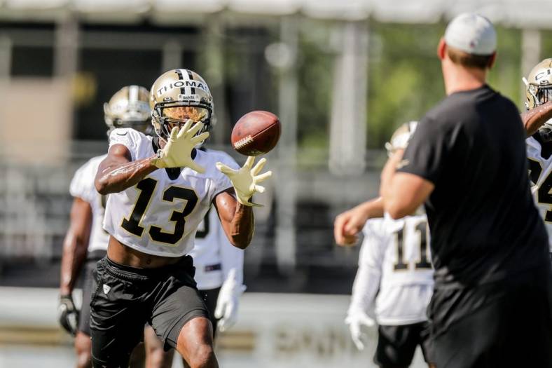 Jul 27, 2022; Metairie, LA, USA; New Orleans Saints wide receiver Michael Thomas (13) works on receiver drills during training camp at Ochsner Sports Performance Center. Mandatory Credit: Stephen Lew-USA TODAY Sports