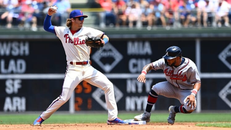 Jul 27, 2022; Philadelphia, Pennsylvania, USA; Philadelphia Phillies infielder Bryson Stott (5) attempts to turn a double play over Atlanta Braves outfielder Eddie Rosario (8) in the second inning at Citizens Bank Park. Mandatory Credit: Kyle Ross-USA TODAY Sports