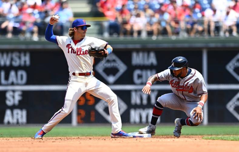 Jul 27, 2022; Philadelphia, Pennsylvania, USA; Philadelphia Phillies infielder Bryson Stott (5) attempts to turn a double play over Atlanta Braves outfielder Eddie Rosario (8) in the second inning at Citizens Bank Park. Mandatory Credit: Kyle Ross-USA TODAY Sports