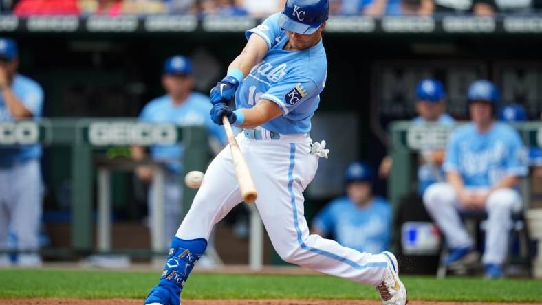 Jul 27, 2022; Kansas City, Missouri, USA; Kansas City Royals designated hitter Andrew Benintendi (16) hits a single against the Los Angeles Angels during the first inning at Kauffman Stadium. Mandatory Credit: Jay Biggerstaff-USA TODAY Sports