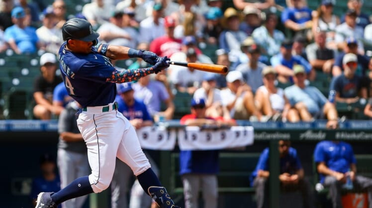 Jul 27, 2022; Seattle, Washington, USA; Seattle Mariners center fielder Julio Rodriguez (44) hits a three-run home run against the Texas Rangers during the seventh inning at T-Mobile Park. Mandatory Credit: Lindsey Wasson-USA TODAY Sports