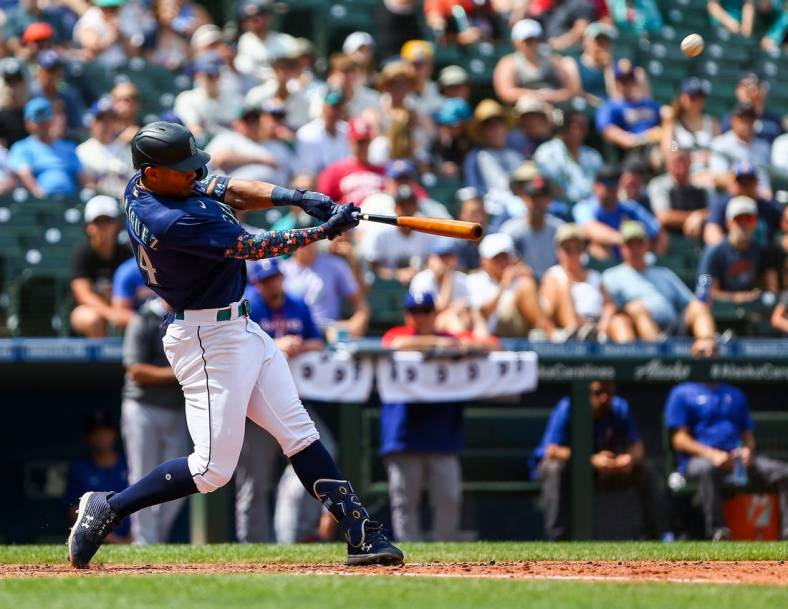 Jul 27, 2022; Seattle, Washington, USA; Seattle Mariners center fielder Julio Rodriguez (44) hits a three-run home run against the Texas Rangers during the seventh inning at T-Mobile Park. Mandatory Credit: Lindsey Wasson-USA TODAY Sports