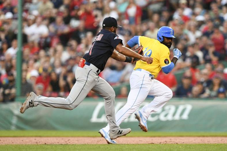 Jul 27, 2022; Boston, Massachusetts, USA; Cleveland Guardians shortstop Amed Rosario (1) tags out Boston Red Sox right fielder Jackie Bradley Jr. (19) during the second inning at Fenway Park. Mandatory Credit: Brian Fluharty-USA TODAY Sports