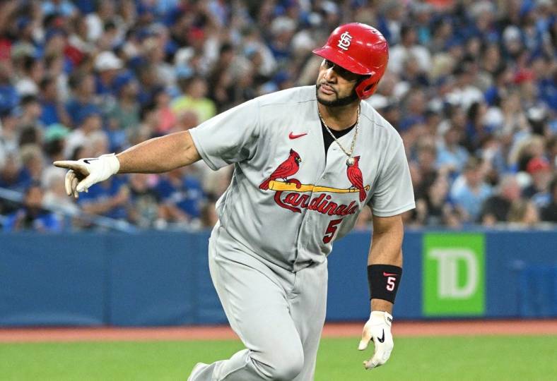 Jul 27, 2022; Toronto, Ontario, CAN;  St. Louis Cardinals first baseman Albert Pujols (5) reacts after hitting a three run home run against the Toronto Blue Jays in the fifth inning at Rogers Centre. Mandatory Credit: Dan Hamilton-USA TODAY Sports