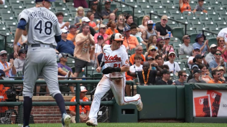 Jul 28, 2022; Baltimore, Maryland, USA; Baltimore Orioles outfielder Austin Hays (21) scores in the third inning against the Tampa Bay Rays at Oriole Park at Camden Yards. Mandatory Credit: Mitch Stringer-USA TODAY Sports
