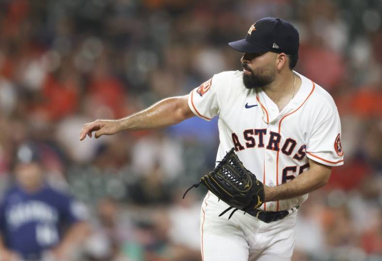Jul 28, 2022; Houston, Texas, USA; Houston Astros starting pitcher Jose Urquidy (65) pitches against the Seattle Mariners in fifth inning at Minute Maid Park. Mandatory Credit: Thomas Shea-USA TODAY Sports