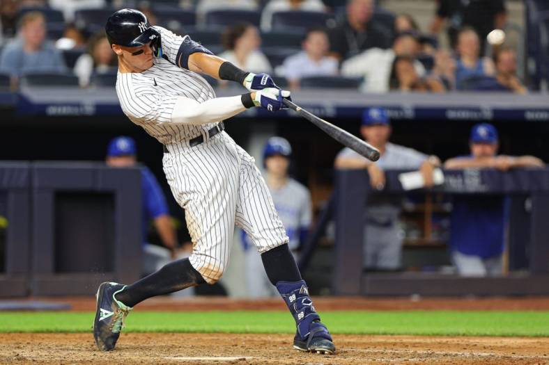 Jul 28, 2022; Bronx, New York, USA; New York Yankees center fielder Aaron Judge (99) hits a walk-off solo home run during the bottom of the ninth inning against the Kansas City Royals at Yankee Stadium. Mandatory Credit: Vincent Carchietta-USA TODAY Sports