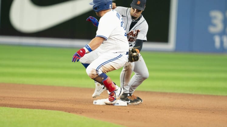Jul 28, 2022; Toronto, Ontario, CAN; Toronto Blue Jays designated hitter Alejandro Kirk (30) slides into second base safe ahead of the tag from Detroit Tigers shortstop Javier Baez (28) during the seventh inning at Rogers Centre. Mandatory Credit: Nick Turchiaro-USA TODAY Sports