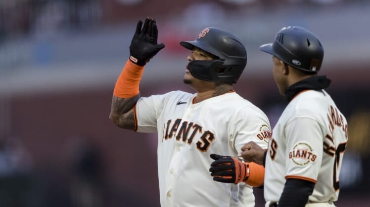 Jul 28, 2022; San Francisco, California, USA;  San Francisco Giants designated hitter Yermin Mercedes (6) reacts next to first base coach Antoan Richardson (00) after hitting a bases-loaded two-run single against the Chicago Cubs during the third inning at Oracle Park. Mandatory Credit: John Hefti-USA TODAY Sports