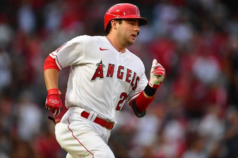 Jul 28, 2022; Anaheim, California, USA; Los Angeles Angels second baseman David Fletcher (22) runs after hitting a double against the Texas Rangers during the third inning at Angel Stadium. Mandatory Credit: Gary A. Vasquez-USA TODAY Sports
