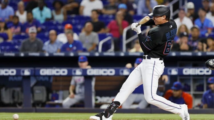 Jul 29, 2022; Miami, Florida, USA; Miami Marlins center fielder JJ Bleday (67) hits an infield hit during the first inning against the New York Mets at loanDepot Park. Mandatory Credit: Sam Navarro-USA TODAY Sports