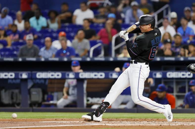 Jul 29, 2022; Miami, Florida, USA; Miami Marlins center fielder JJ Bleday (67) hits an infield hit during the first inning against the New York Mets at loanDepot Park. Mandatory Credit: Sam Navarro-USA TODAY Sports