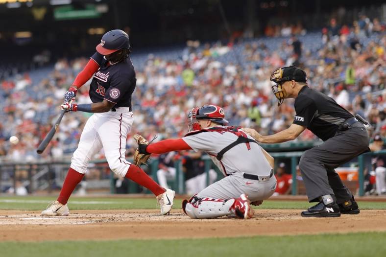 Jul 29, 2022; Washington, District of Columbia, USA; Washington Nationals first baseman Josh Bell (19) hits a single against the St. Louis Cardinals during the second inning at Nationals Park. Mandatory Credit: Geoff Burke-USA TODAY Sports