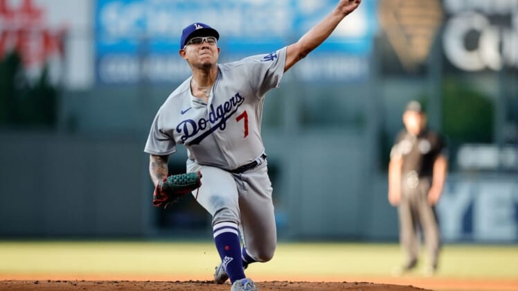 Jul 29, 2022; Denver, Colorado, USA; Los Angeles Dodgers starting pitcher Julio Urias (7) pitches in the first inning against the Colorado Rockies at Coors Field. Mandatory Credit: Isaiah J. Downing-USA TODAY Sports