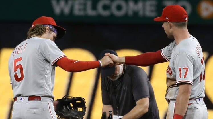 Jul 29, 2022; Pittsburgh, Pennsylvania, USA;  Philadelphia Phillies second baseman Bryson Stott (5) and first baseman Rhys Hoskins (right) celebrate after defeating the Pittsburgh Pirates at PNC Park. The Phillies won 4-2 in ten innings. Mandatory Credit: Charles LeClaire-USA TODAY Sports