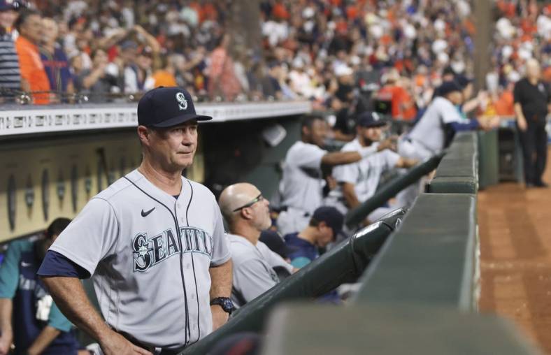 Jul 29, 2022; Houston, Texas, USA; Seattle Mariners manager Scott Servais (9) watches play against the Houston Astros in the seventh inning at Minute Maid Park. Mandatory Credit: Thomas Shea-USA TODAY Sports