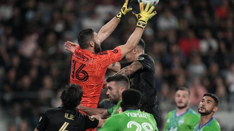 Jul 29, 2022; Los Angeles, California, USA; LAFC goalkeeper Maxime Crepeau (16) makes a save against the Seattle Sounders in the first half at Banc of California Stadium. Mandatory Credit: Kirby Lee-USA TODAY Sports