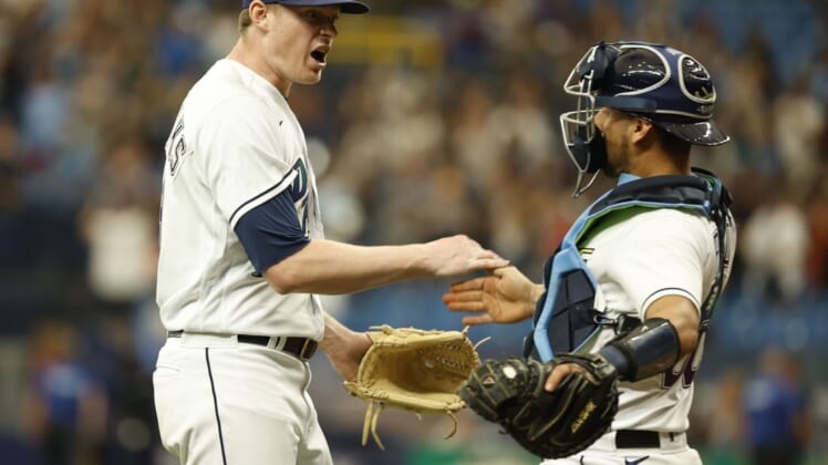 Jul 30, 2022; St. Petersburg, Florida, USA; Tampa Bay Rays relief pitcher Pete Fairbanks (29) and catcher Rene Pinto (50) celebrate as they beat the Cleveland Guardians at Tropicana Field. Mandatory Credit: Kim Klement-USA TODAY Sports