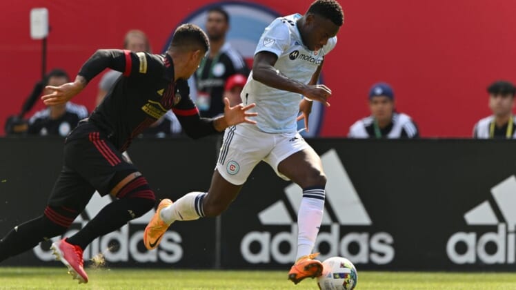 Jul 30, 2022; Chicago, Illinois, USA; Chicago Fire FC forward Jhon Duran (26) controls the ball as Atlanta United FC defender Alan Franco (6) defends in the first half at Soldier Field. Mandatory Credit: Jamie Sabau-USA TODAY Sports