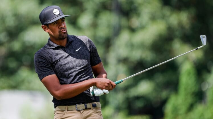 Tony Finau tees off for a par-3 9 green during Round 3 of the Rocket Mortgage Classic at the Detroit Golf Club in Detroit on Saturday, July 30, 2022.
